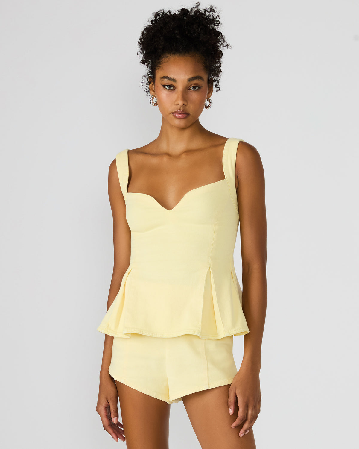 ZENIA Golden Glow Sleeveless Peplum Women's Top